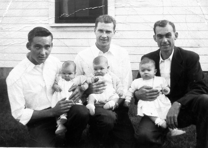 Photo of three babies & three very proud fathers.
